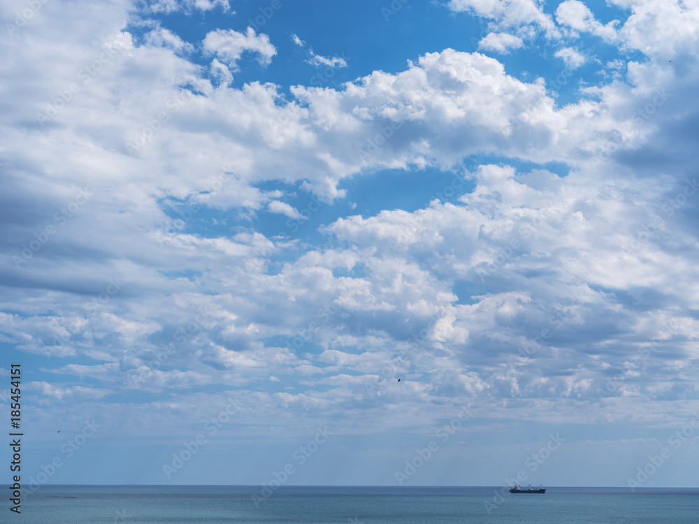Calm sea and cloudy sky. Nature background.
