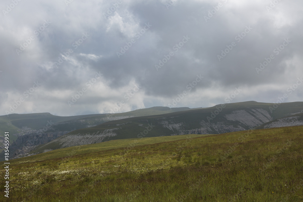 Russia, time lapse. The formation and movement of clouds over the summer slopes of Adygea Bolshoy Thach and the Caucasus Mountains