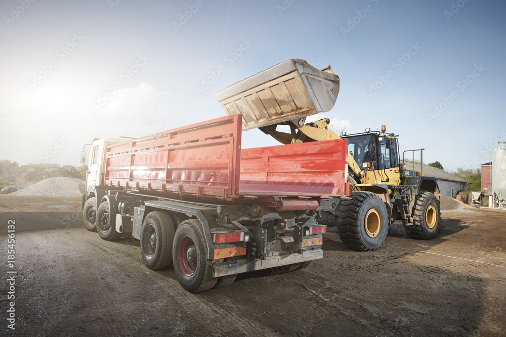Fototapeta premium Excavator moving sand and gravel