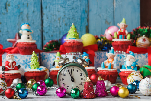Christmas cupcakes with colored decorations made from confectionery mastic