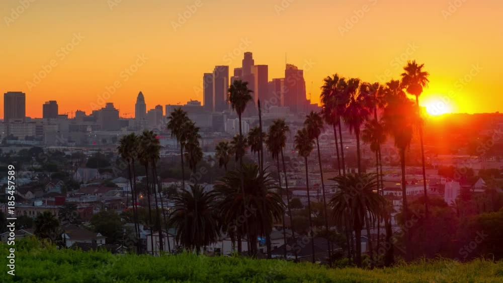 Sunset to night zoom out from city of Los Angeles downtown skyline