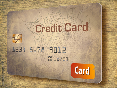 Old credit card accounts you don't use could be closed by the issuer and adversely impact your credit score. This is a 3-D illustration of an aged and unused credit card.