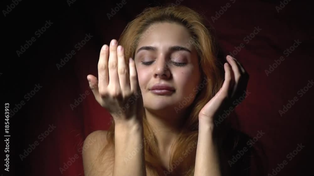 Beautiful woman crying and wiping her tears with her hands, bit slow motion Beautiful woman crying and wiping her tears with her hands, bit slow motion