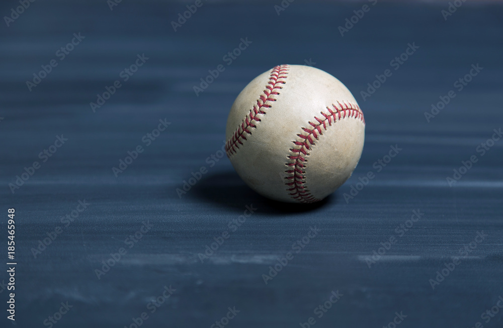 Baseball on a old chalkboard desk surface with copy space background