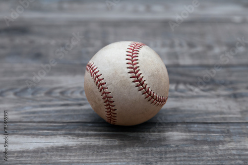Baseball on a old rustic wooden desk with copy space background