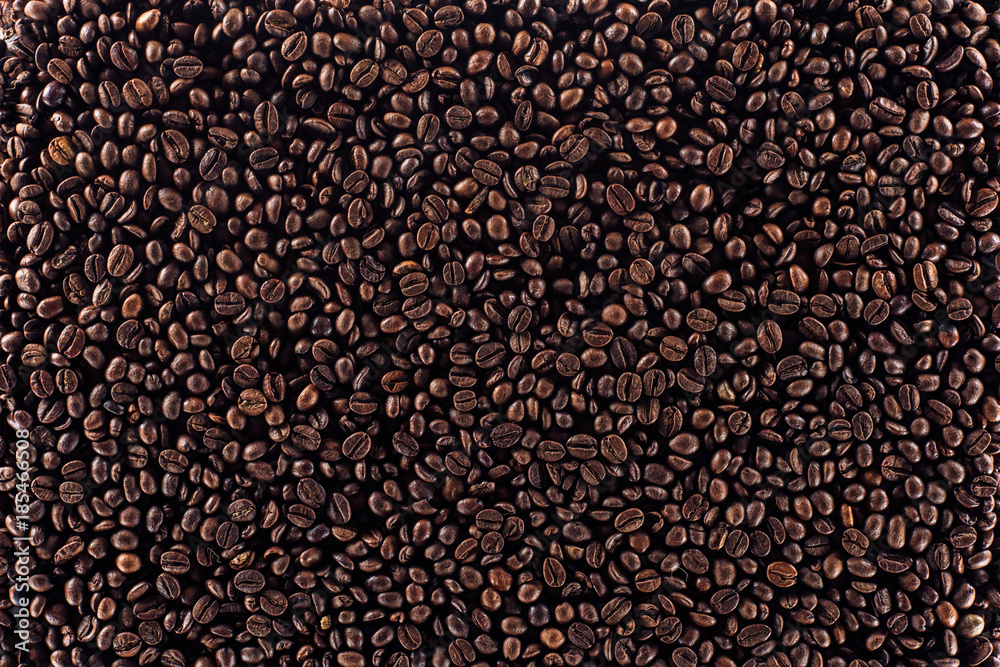full frame of aromatic roasted coffee beans background