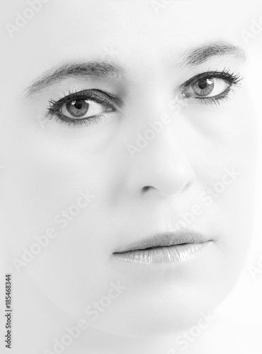 High key portrait of a woman with empty expression on her face