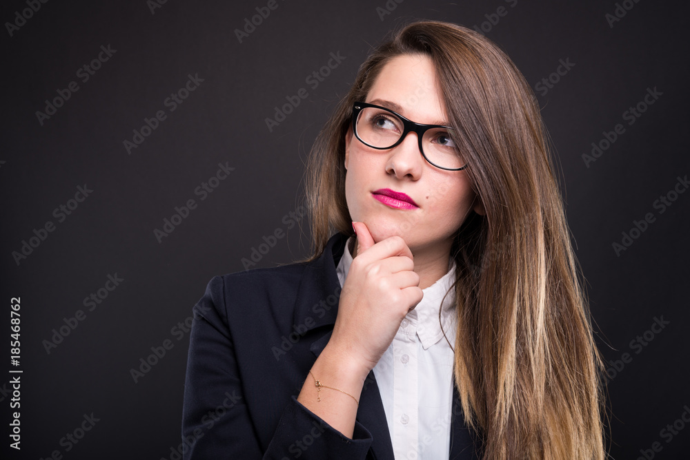 Portrait of pensive business female looking away Portrait of pensive business female looking away
