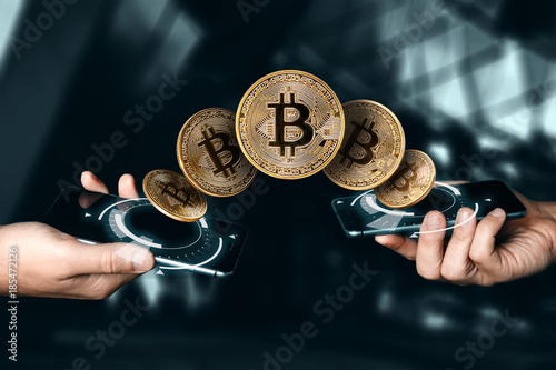 Cuadro en lienzo Gold coin Bitcoin payment from phone to phone, hands and TVs close-up