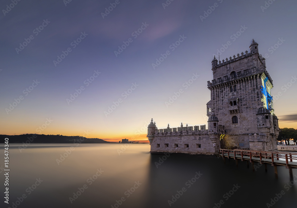 Long exposure photography of Belem Tower of St. Vincent in the civil parish of Santa Maria de Belem in the municipality of Lisbon at sunset, Portugal