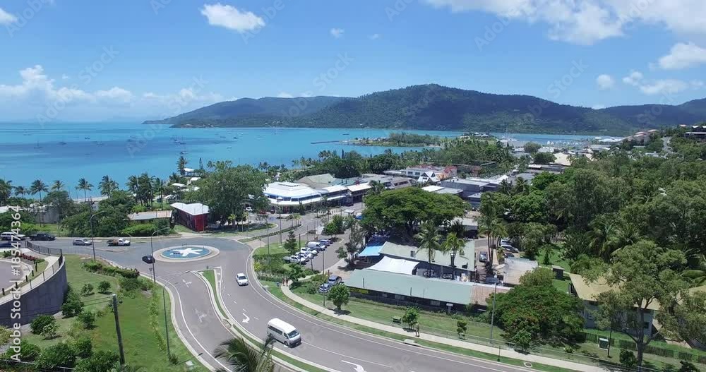 WHITSUNDAY ISLANDS – FEBRUARY 2016 : Aerial shot over Airlie Beach cityscape on a beautiful day with boats and beach in view