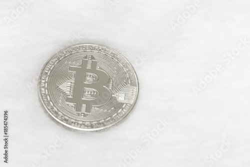 Bitcoin silver coin on a white background. Close-up