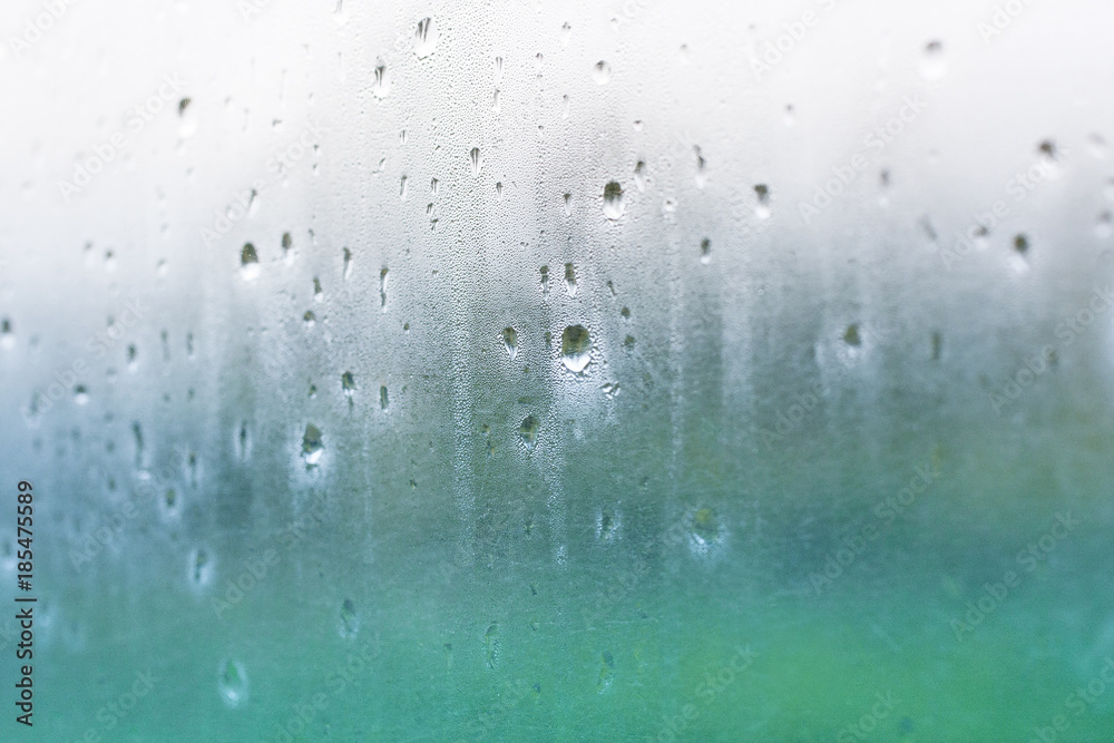 Water drops on misted glass Water drops on misted glass