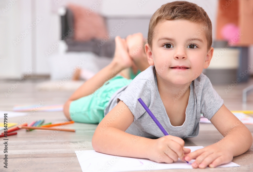 Cute little boy drawing at home Cute little boy drawing at home