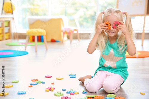 Cute little girl posing wit...