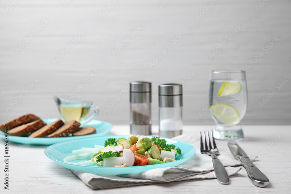 Plate of tasty salad with Brussels sprouts on table Plate of tasty salad with Brussels sprouts on table