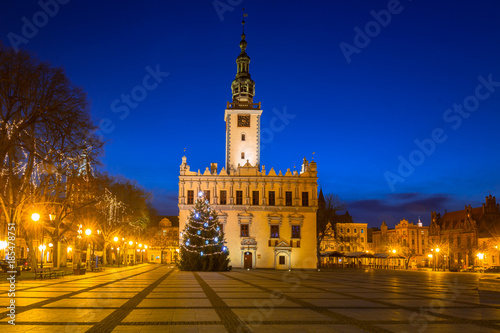 Old town square with historical town hall in Chelmno at night, Poland