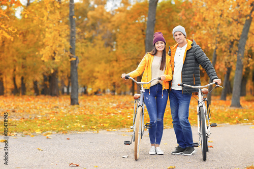 Young couple walking with b...