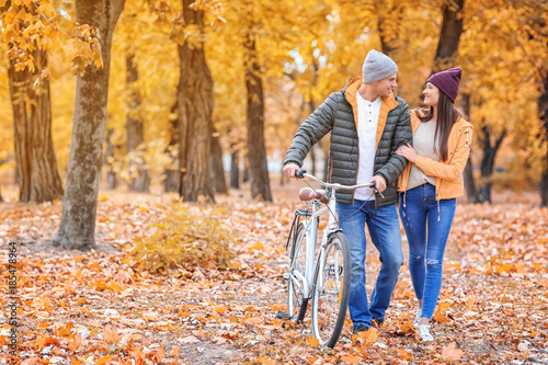 Young couple walking with b...