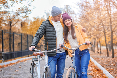 Young couple walking with b...