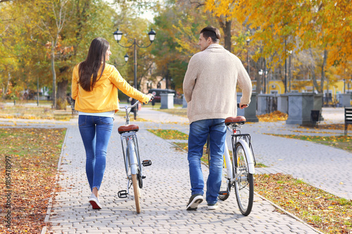 Young couple walking with b...
