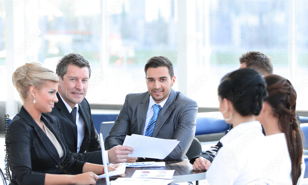 business partners and business team discussing business issues in office business partners and business team discussing business issues in office