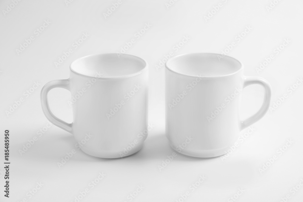 Ceramic cups on white background. Mockup for design Ceramic cups on white background. Mockup for design