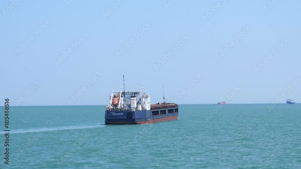 Huge container ship floating in the sea in slow motion. 3840x2160 Huge container ship floating in the sea in slow motion. 3840x2160