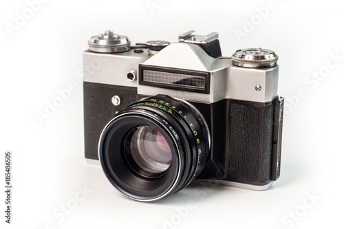 Retro film photo camera isolated on white background. Old analog