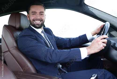 portrait of confident businessman driving a car © ASDF