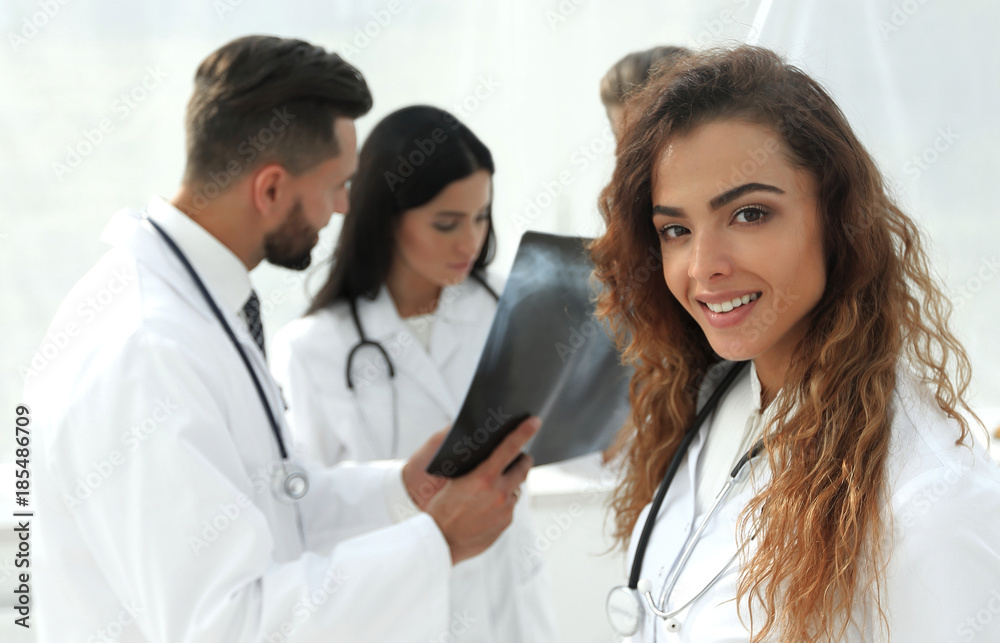 confident doctors in hospital looking at x-ray. confident doctors in hospital looking at x-ray.
