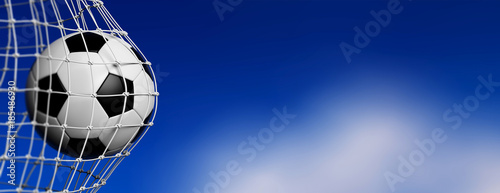 Football soccer ball in goal, blue sky background. 3d illustration