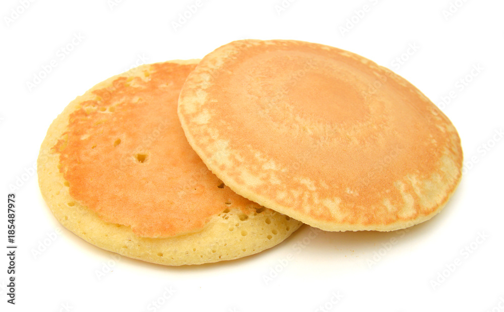 Two of plain pancakes on a white background. Two of plain pancakes on a white background.