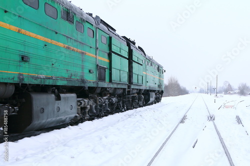 Locomotive at the railway station in the winter. photo