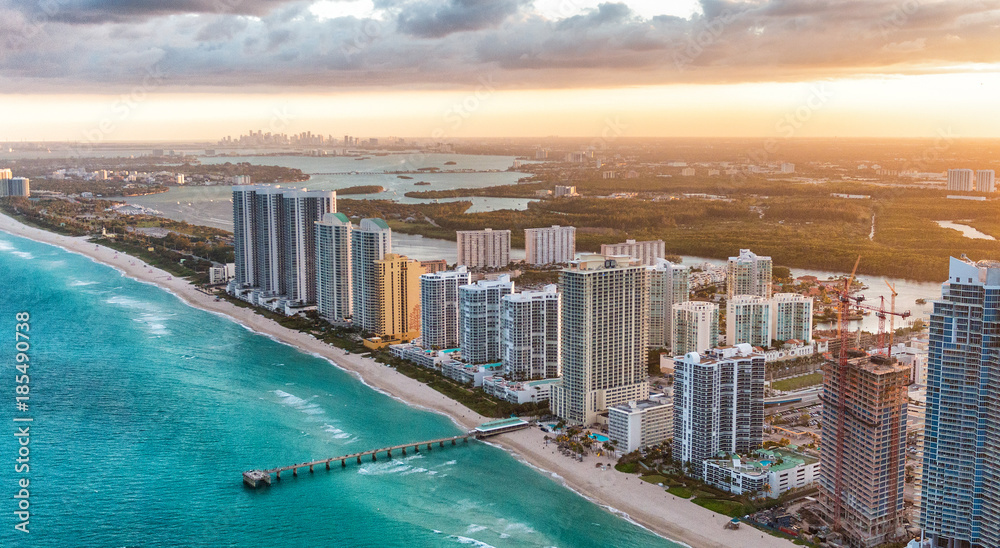 Miami Beach buildings at dusk, aerial view from helicopter - obrazy, fototapety, plakaty 