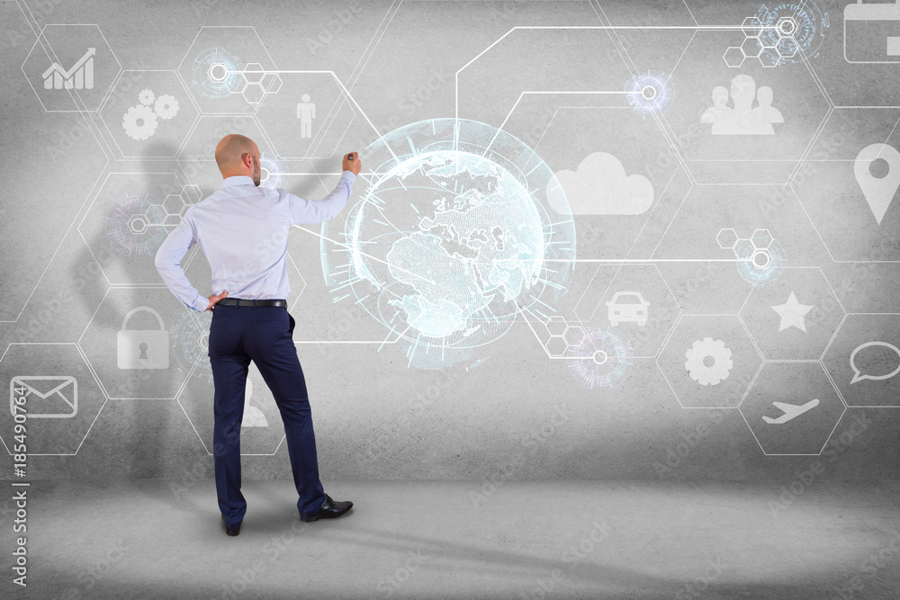 Businessman in front of a wall with an International business network connection displayed on a futuristic interface with technology icon and sphere globe - Worldwide business concept Businessman in front of a wall with an International business network connection displayed on a futuristic interface with technology icon and sphere globe - Worldwide business concept