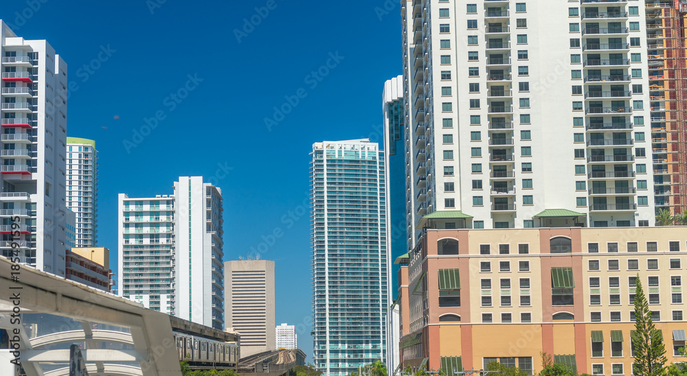 MIAMI - FEBRUARY 2016: Aerial city skyline from a moving train. Miami attracts 20 million people every year MIAMI - FEBRUARY 2016: Aerial city skyline from a moving train. Miami attracts 20 million people every year