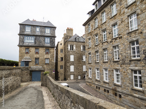 Saint Malo, Normandy, France. Architectural building with typical roofs and chimney.
