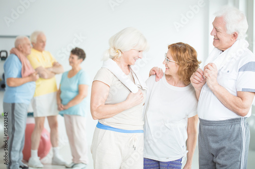 Elderly girlfriends at pilates class