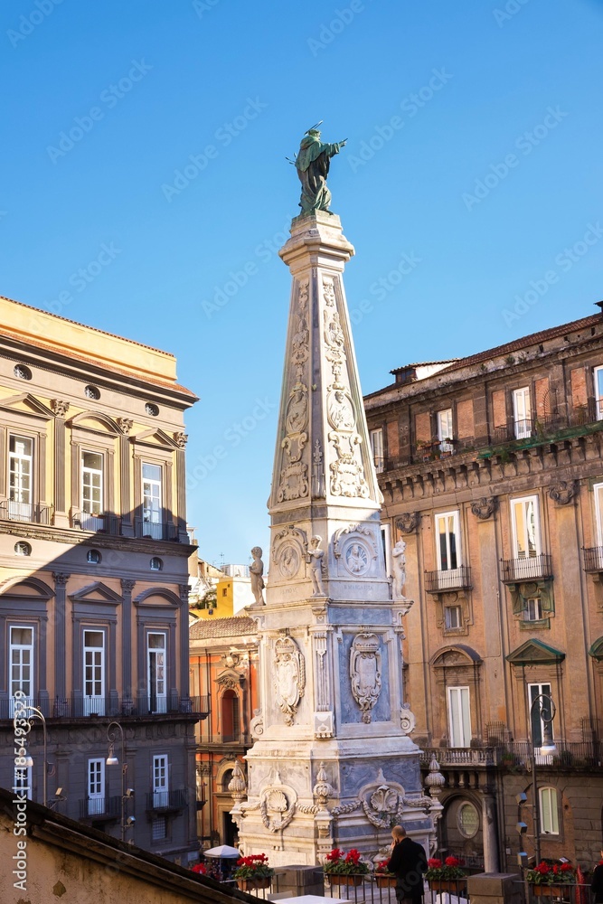 The obelisk of San domenico church and square in Naples, Italy