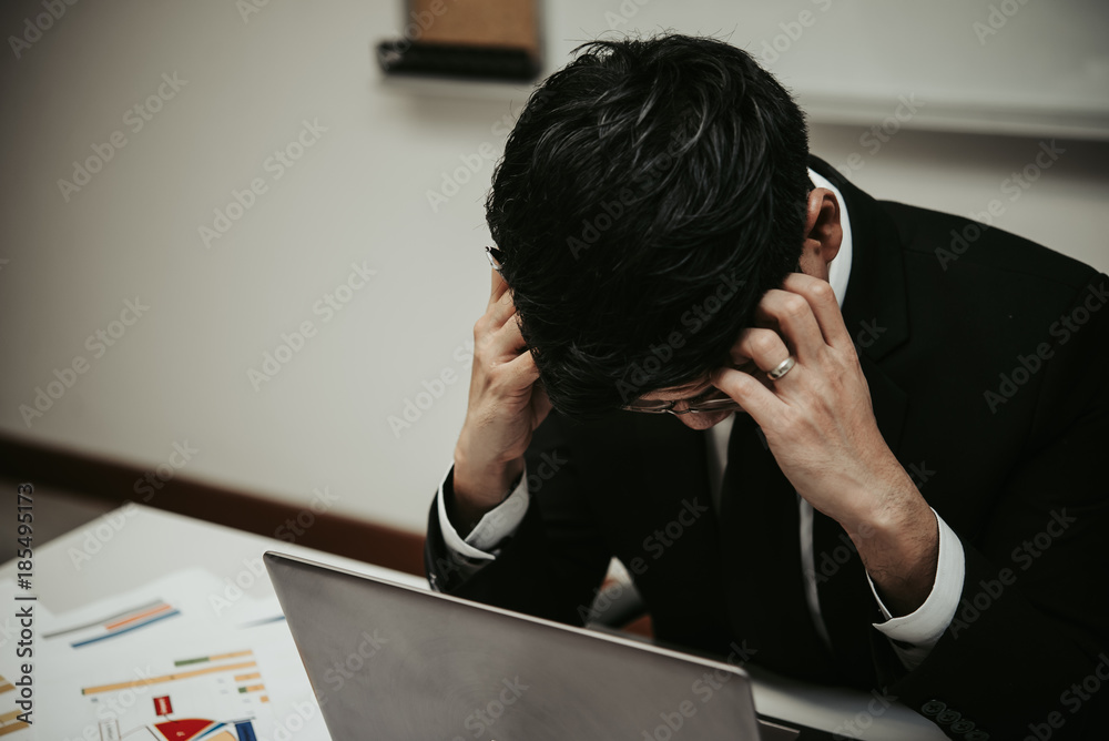 Close up stress Asian businessman,Fail from work,Thailand people,Not success from business,Sadness man concept Close up stress Asian businessman,Fail from work,Thailand people,Not success from business,Sadness man concept