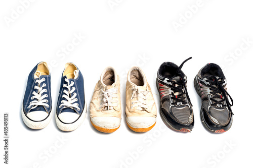 vintage used shoes on white background.Old sneakers on white.