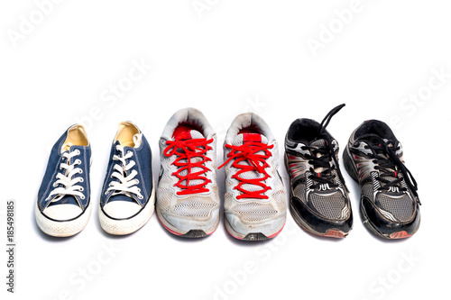 vintage used shoes on white background.Old sneakers on white.