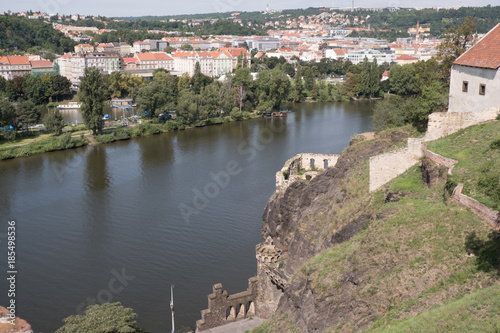 View of Prague and the Vltava River from Vysehrad Fortress. Looking across the Vltava River and a European town.