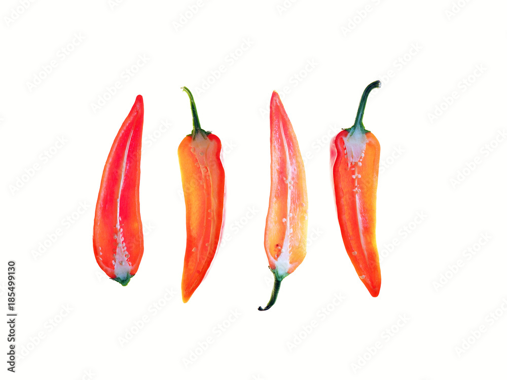 Red pepper cut in half isolated on white background. Group of peppers, fresh vegetables. Healthy food. Capsicum longum, solanaceae