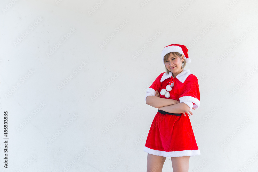 Obraz premium Beautiful young asian woman in Santa Claus clothes on white background,Thailand people,Sent happiness for children,Merry christmas,Welcome to winter,Happy woman concept