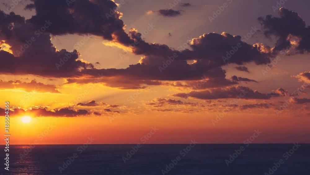 Timelapse of sunrise over the sea with clouds on sky. Morning travel