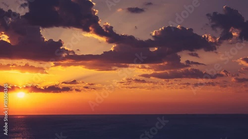 Timelapse of sunrise over the sea with clouds on sky. Morning travel