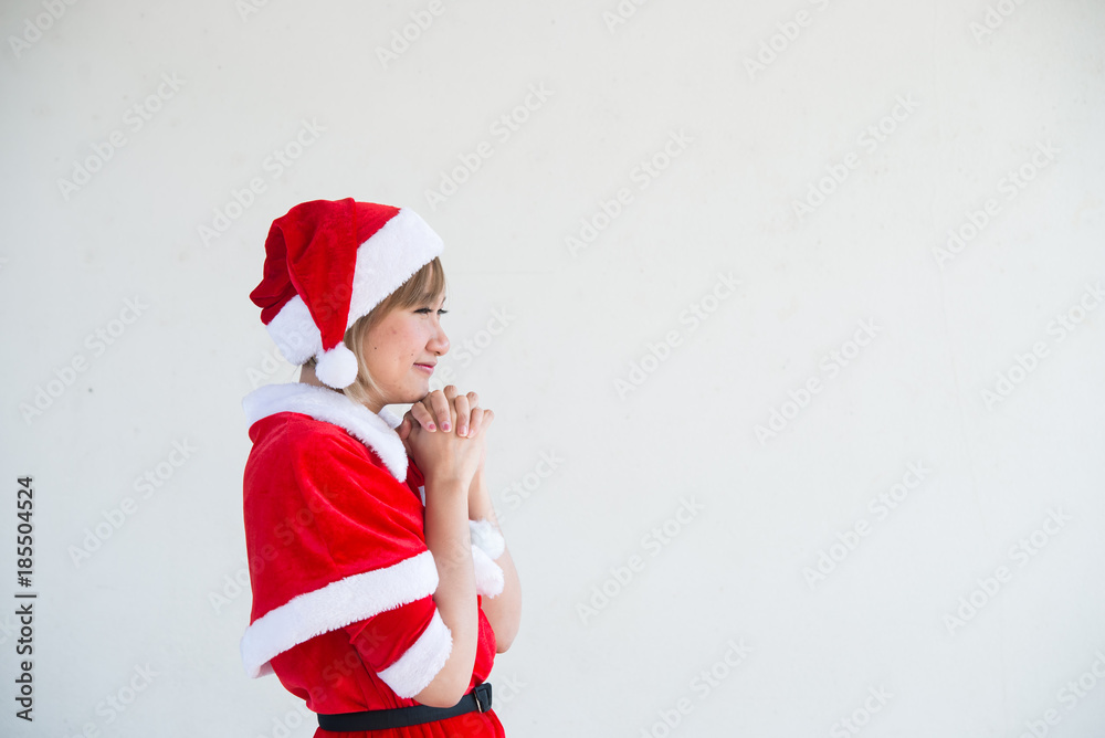 Beautiful young asian woman in Santa Claus clothes on white background,Thailand people,Sent happiness for children,Merry christmas,Welcome to winter,Happy woman concept Beautiful young asian woman in Santa Claus clothes on white background,Thailand people,Sent happiness for children,Merry christmas,Welcome to winter,Happy woman concept