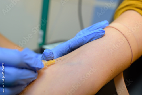 Needle being inserted into vein